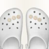 Colgante Jibbitz™ para zapatos con letra X dorada