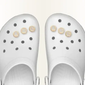 Colgante Jibbitz™ para zapatos con letra X dorada